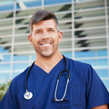 demo-attachment-57-smiling-male-healthcare-worker-outside-hospital-resized