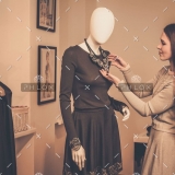 demo-attachment-955-young-woman-looking-at-necklace-on-mannequin-in-PSQQMMH-1